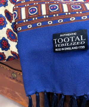Tootal navy rayon scarf with rose print and border design, featuring hand-tied fringes and lightweight double-faced fabric.