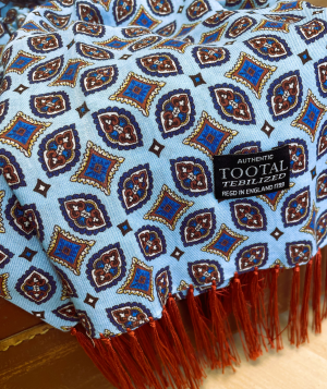 Tootal rayon scarf in deep blue with oval geometric print, red fringe, and a soft, double-faced finish.