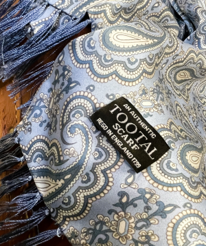 Tootal sky blue silk scarf with paisley pattern and fringe ends, made from 100% silk.