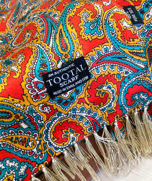 Tootal silk scarf with red, gold, and green paisley design, 100% silk with fringe ends and heritage styling.