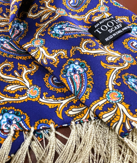 Tootal navy and gold paisley silk scarf with fringed ends, double-faced, crafted from 100% pure silk.