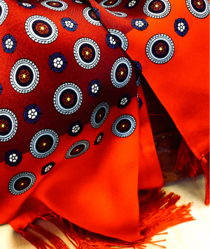 Tootal silk scarf in bordeaux red with circle pattern and border, made from 100% silk with soft fringe ends.